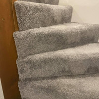 corner stairs with grey carpet