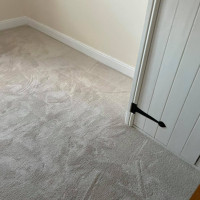 cream carpet fitted in a room