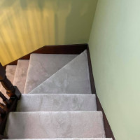 corner stairs fitted with cream carpet