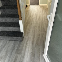 house entrance fitted with grey laminate
