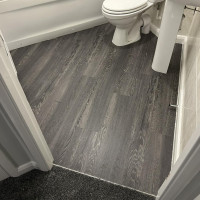 Wood effect LVT fitted in a bathroom